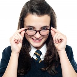 Girl student with geeky glasses smiling