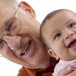 Grandfather holding grandchild in his arms