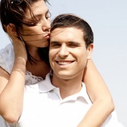Wife giving her husband a kiss