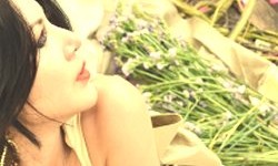 Sad bride lying with flowers strewn