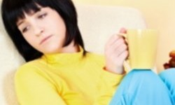 Sad girl holding a coffee mug thumbnail