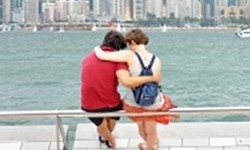 Thumbnail of couple sitting at waterfront