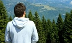 Man looking at mountains