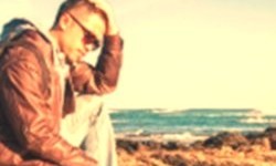 Sad guy sitting on a cliff thumbnail